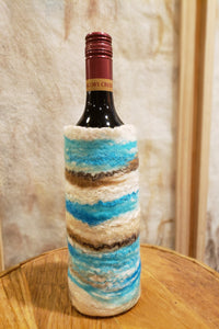 Versatile vase or wine holder in coastal design, hand made from merino wool & raw silk. Beach style life decor.