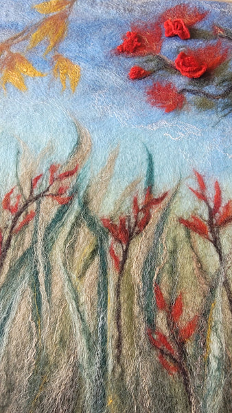 Textured artwork with red and green abstract elements on a blue background