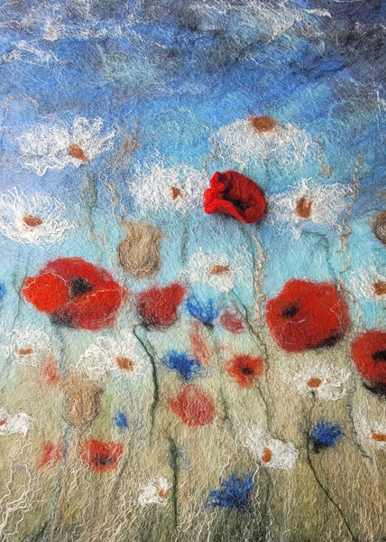 Textile art piece with red flowers and a blue sky background