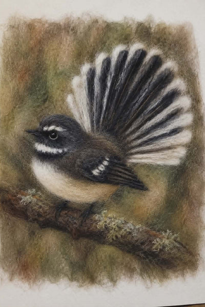needle felting fantail birds on a dark background