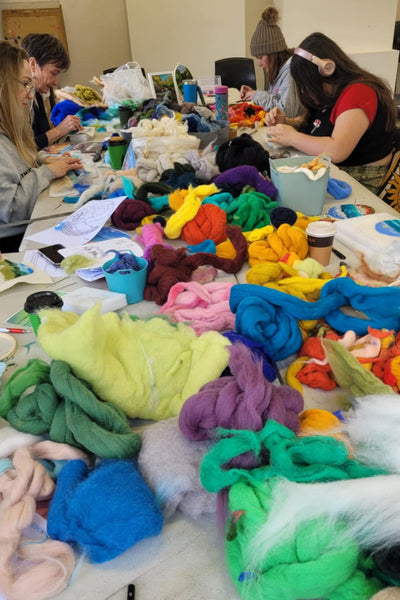 Wool workshop with a group of people using merino 
wool.