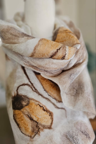 Marbled fabric with brown and beige patterns on a blurred background
