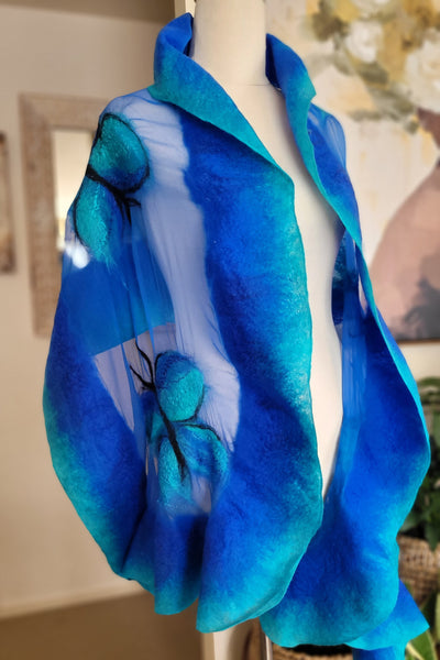 Blue fabric with floral patterns on a neutral background