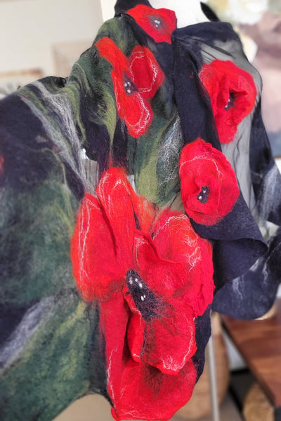 Artistic scarf with red floral patterns on a dark background