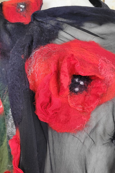 Red poppy flowers on a black chiffon silk background