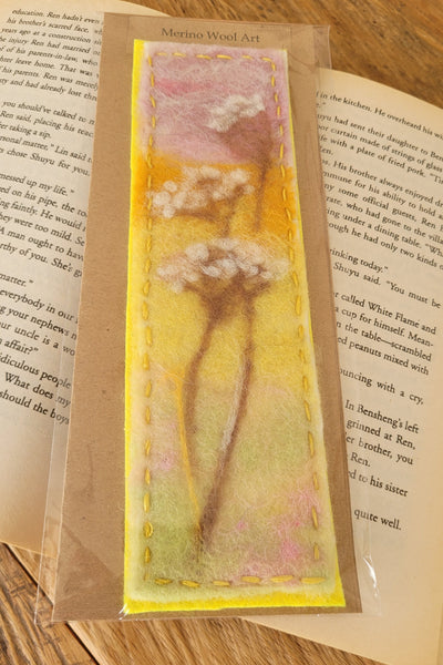 Decorative bookmark with floral design on a book page