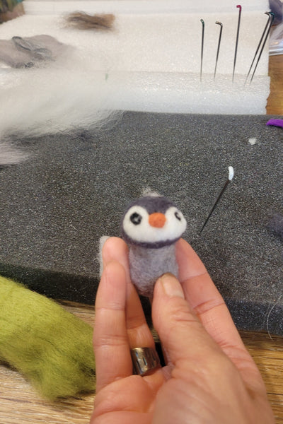 Hand felting a penguin with a needle, workshop felted animals