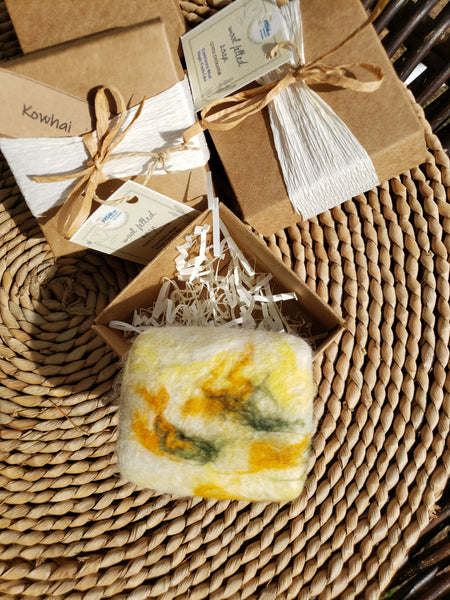 Wool Soap kowhai, covered felted merino wool. Gentle exfoliator skin and body.