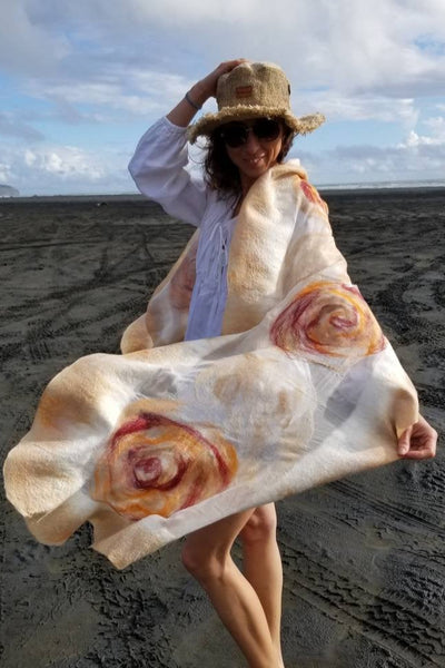 Cream and nude shawl made from merino wool and silk. Handmade large shawl with women on the beach.