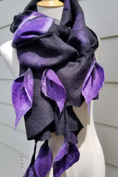 Purple lilies on black shawl, wet felted scarf wrapped around mannequin